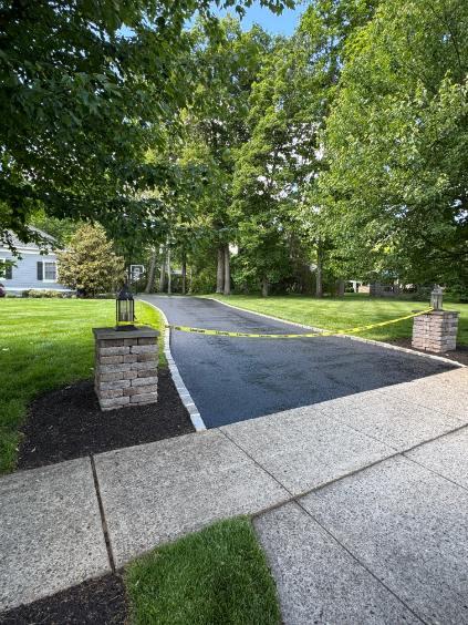 Freshly seal-coated residential driveway